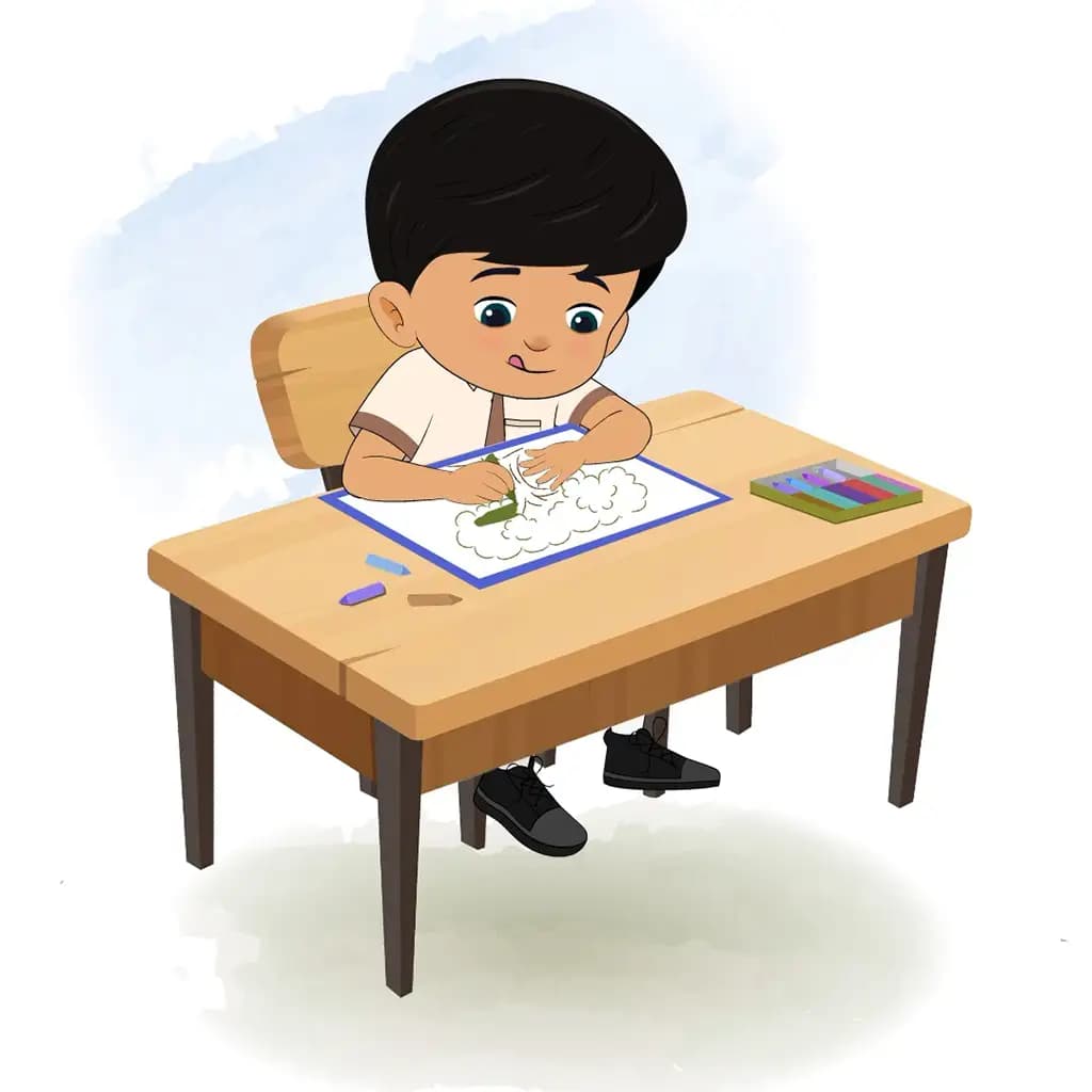 An Indian school boy is sitting at a table with some crayons and colouring on the paper aka rohan