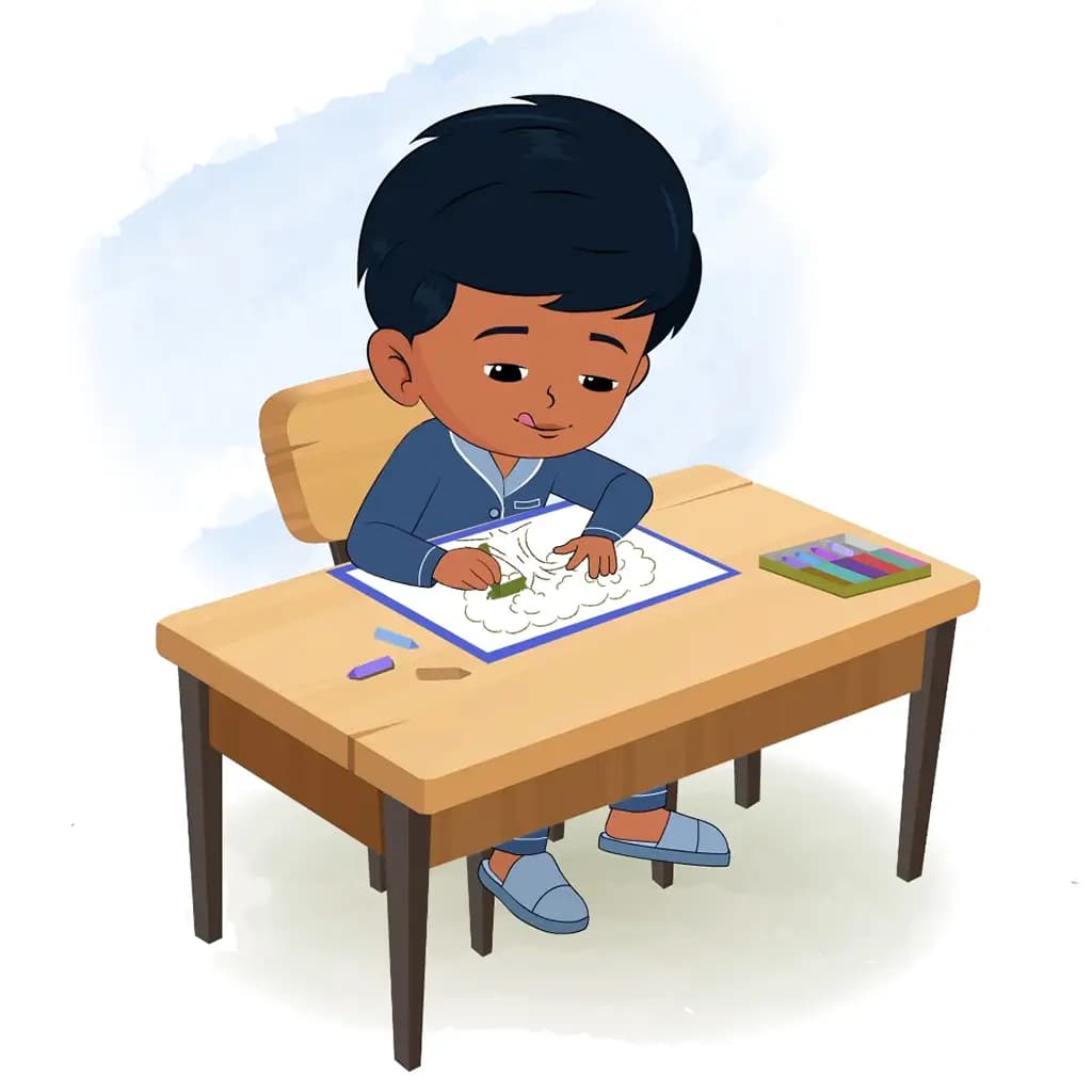An Indian boy is sitting at a table with some crayons and colouring on the paper aka arun