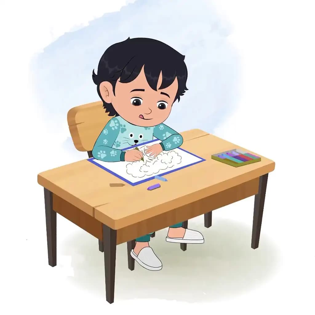 An Indian little boy is sitting at a table with some crayons and colouring on the paper aka min min