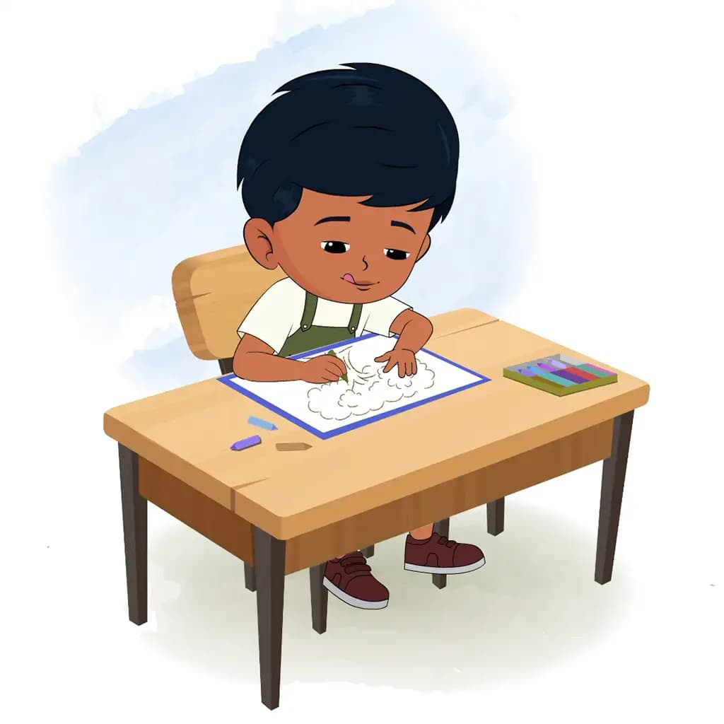 A little charming boy is sitting at a table with some crayons and colouring on the paper aka arun