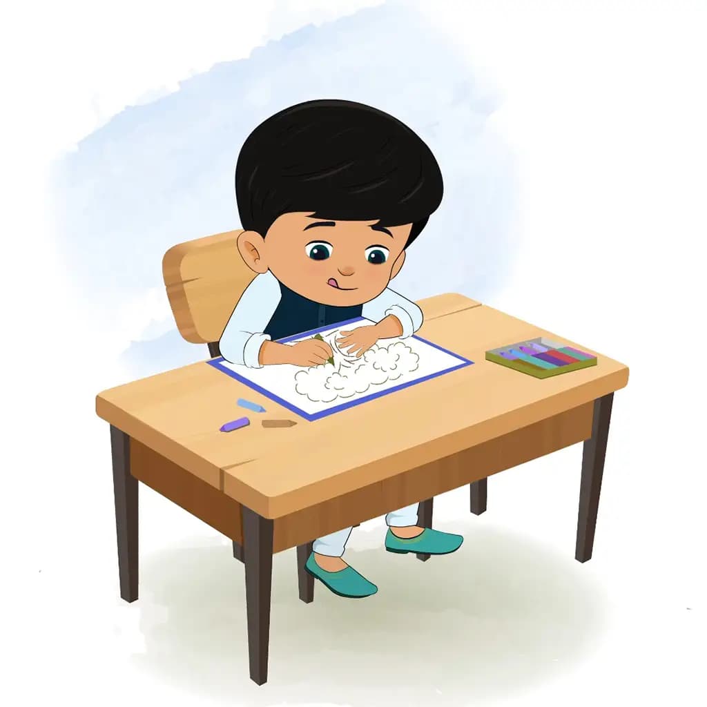 An Indian boy is sitting at a table with some crayons and colouring on the paper aka rohan
